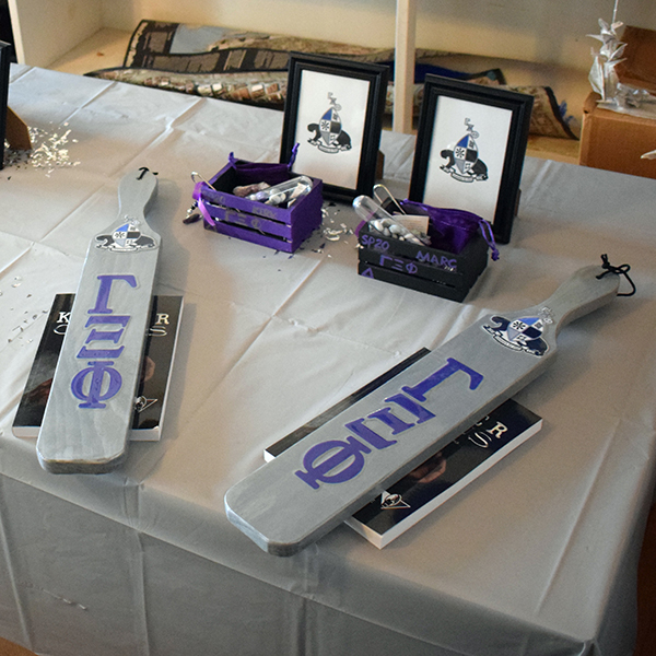 Fraternity paddles and other crossing gifts.